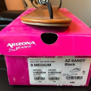AZ sandy black flip flops